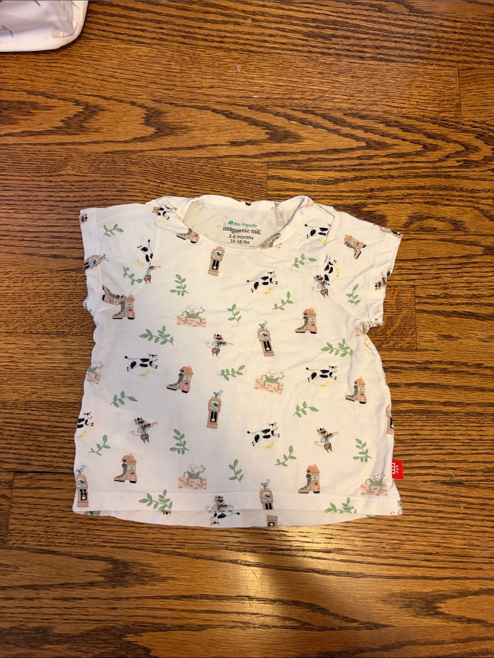 Magnetic Me White Baby Tee with Nursery Rhyme Print